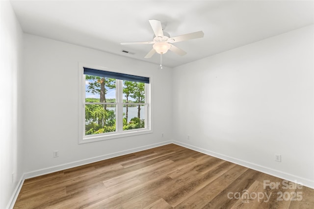 2218 Mallard Cove Dr, Nebo, NC 28761 - spare room featuring wood finished floors, baseboards, and a water view