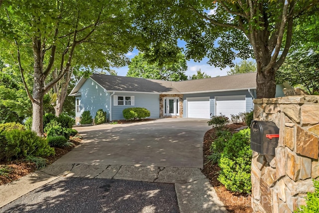2218 Mallard Cove Dr, Nebo, NC 28761 - ranch-style home with an attached garage and concrete driveway