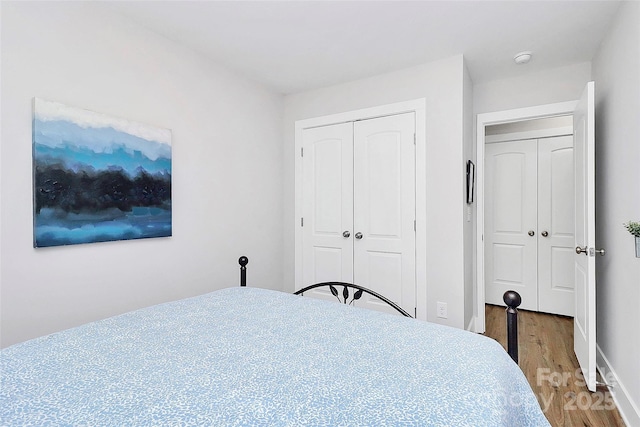1066 Mclain Rd Unit 14, Kannapolis, NC 28083 - bedroom featuring wood finished floors, a closet, and baseboards