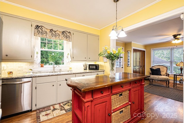 225 Rectory Hill Pl SW, Lenoir, NC 28645 - kitchen featuring dishwasher, a sink, crown molding, wood finished floors, and decorative backsplash