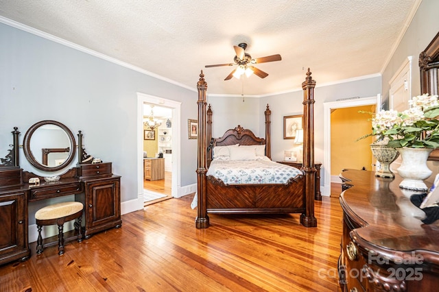 225 Rectory Hill Pl SW, Lenoir, NC 28645 - bedroom with light wood finished floors, a textured ceiling, baseboards, crown molding, and ensuite bath