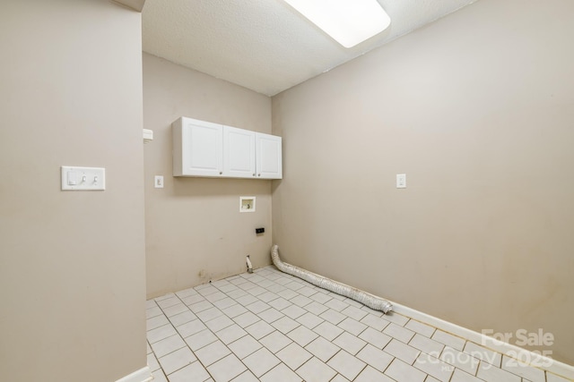 laundry room featuring cabinet space, gas dryer hookup, washer hookup, electric dryer hookup, and baseboards