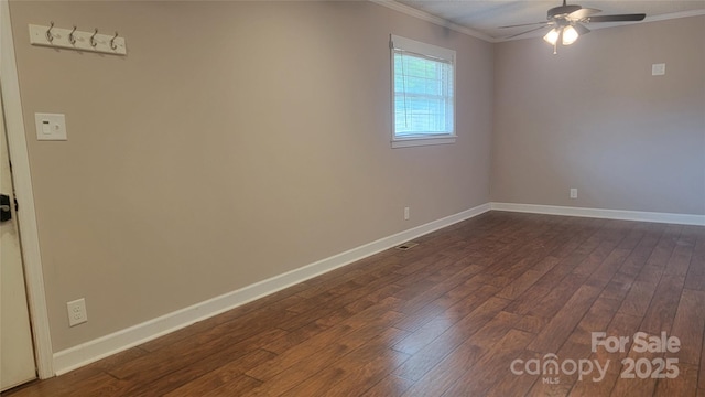unfurnished room featuring ornamental molding, dark wood finished floors, ceiling fan, and baseboards