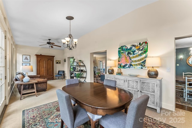 26 White Oak Rd, Asheville, NC 28803 - dining space with a chandelier, light carpet, a ceiling fan, and baseboards