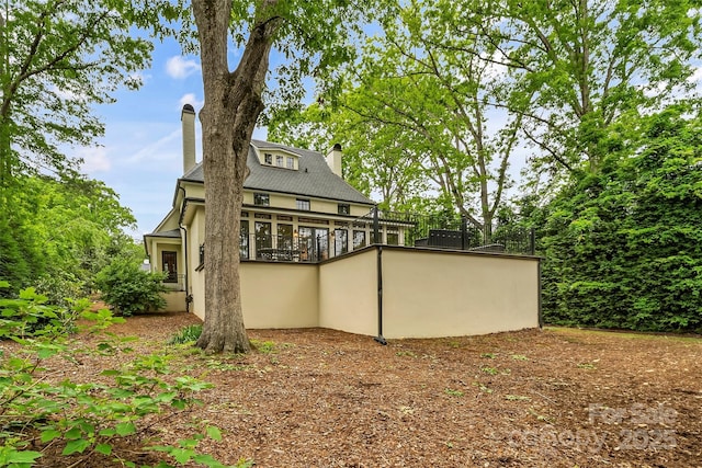 26 White Oak Rd, Asheville, NC 28803 - back of house featuring a chimney and stucco siding
