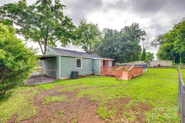 275 N Garrison Rd, Rock Hill, SC 29730 - back of property with a deck, central AC, a chimney, and an attached carport