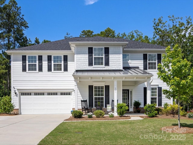 603 Southstone Dr, Matthews, NC 28104 - view of front facade with covered porch, a standing seam roof, concrete driveway, a front yard, and an attached garage