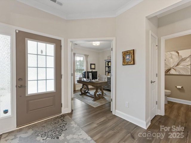 603 Southstone Dr, Matthews, NC 28104 - entryway with wood finished floors, ornamental molding, and baseboards