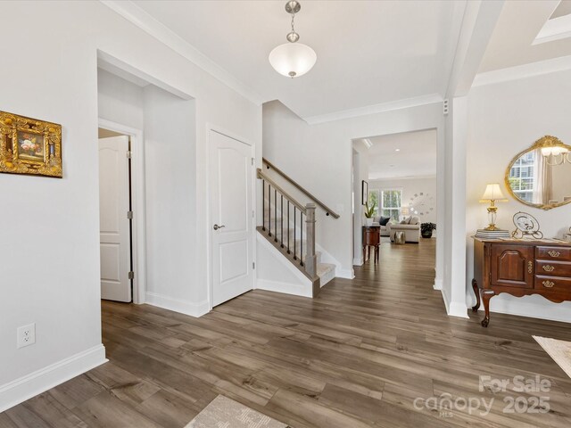 603 Southstone Dr, Matthews, NC 28104 - foyer with stairway, wood finished floors, baseboards, and ornamental molding