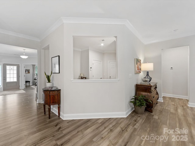 603 Southstone Dr, Matthews, NC 28104 - corridor with wood finished floors, baseboards, and ornamental molding