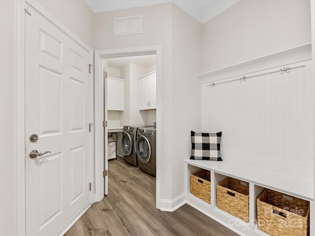 603 Southstone Dr, Matthews, NC 28104 - mudroom featuring washer and clothes dryer, wood finished floors, and baseboards