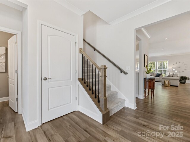 603 Southstone Dr, Matthews, NC 28104 - staircase with wood finished floors and baseboards