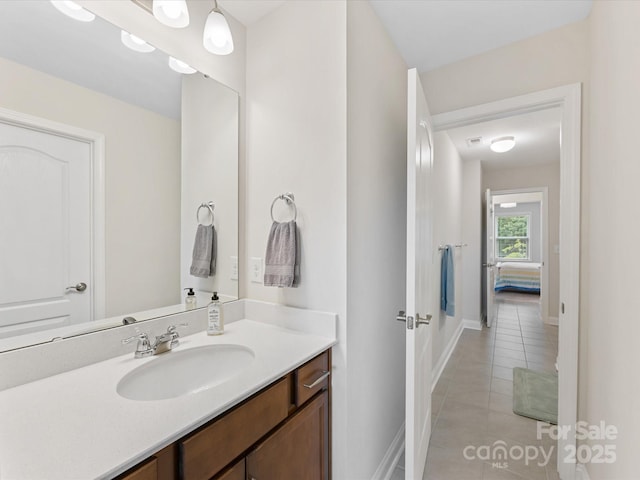603 Southstone Dr, Matthews, NC 28104 - bathroom with tile patterned flooring, baseboards, and vanity
