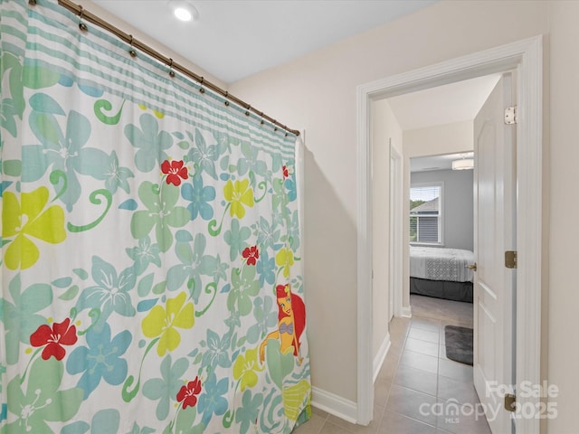 603 Southstone Dr, Matthews, NC 28104 - full bathroom with tile patterned floors, baseboards, and a shower with curtain