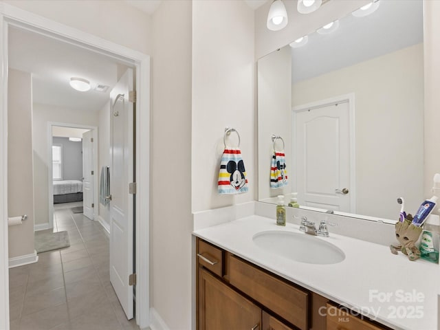 603 Southstone Dr, Matthews, NC 28104 - bathroom with baseboards, tile patterned floors, vanity, and ensuite bath