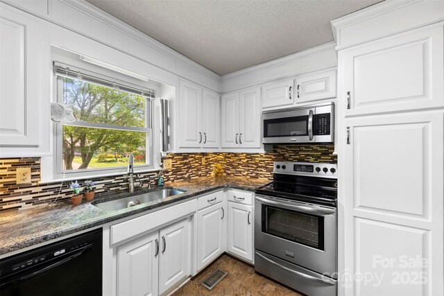 113 Helena St, Mount Holly, NC 28120 - kitchen featuring stainless steel appliances, a sink, decorative backsplash, white cabinetry, and a textured ceiling
