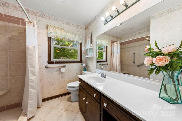 113 Helena St, Mount Holly, NC 28120 - bathroom with wallpapered walls, a tile shower, tile patterned floors, vanity, and toilet