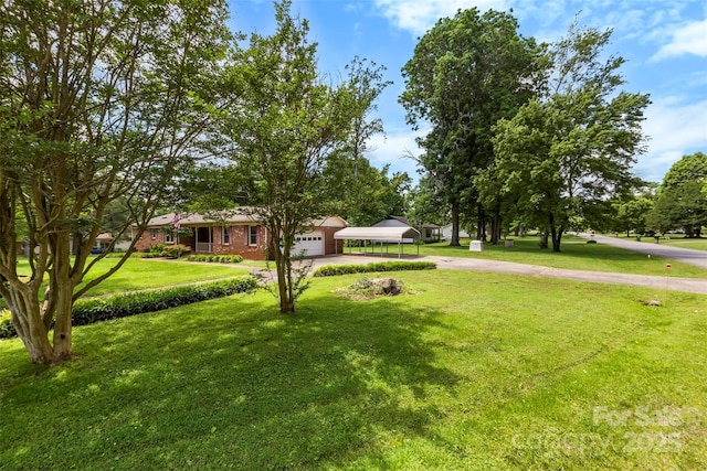 113 Helena St, Mount Holly, NC 28120 - view of front of property featuring driveway, a front lawn, brick siding, and a carport