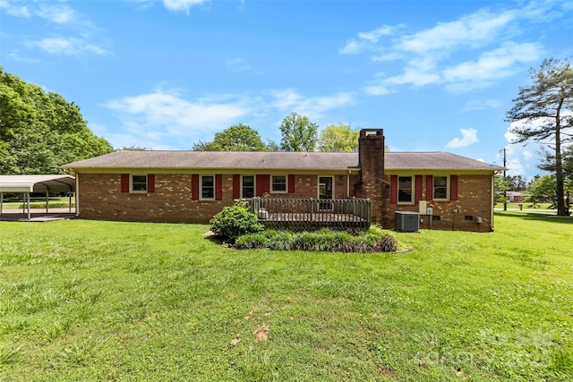 113 Helena St, Mount Holly, NC 28120 - rear view of property featuring a yard, a chimney, brick siding, a deck, and a detached carport