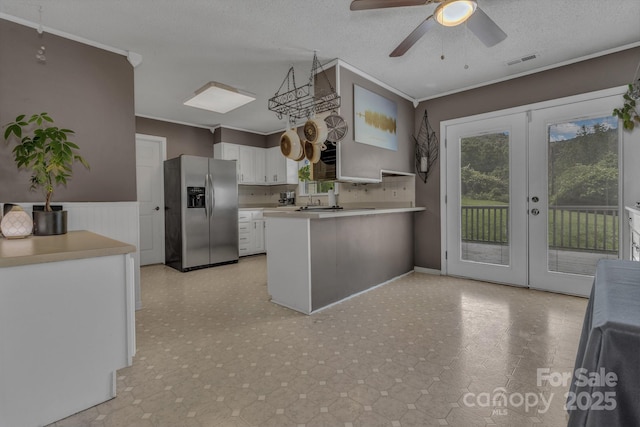11 Chaz Ln, Candler, NC 28715 - kitchen featuring stainless steel fridge with ice dispenser, ornamental molding, french doors, a peninsula, and white cabinets