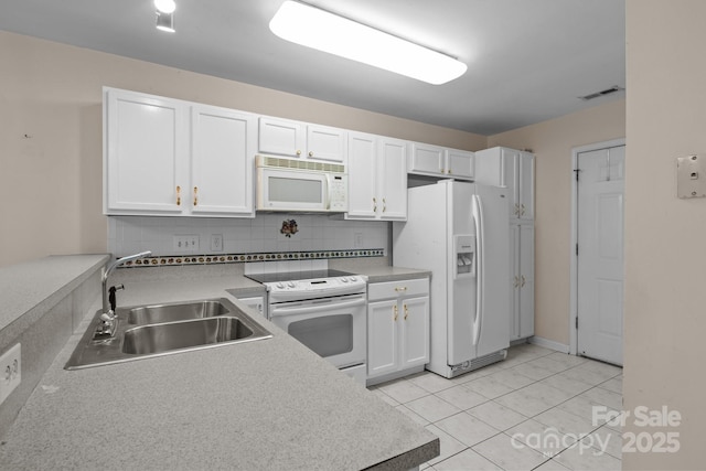 112 Dujon Ct, Mount Holly, NC 28120 - kitchen with white appliances, a sink, white cabinetry, backsplash, and light countertops