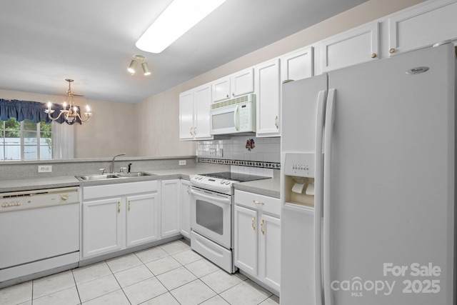 112 Dujon Ct, Mount Holly, NC 28120 - kitchen with white appliances, a sink, light tile patterned floors, white cabinets, and a chandelier