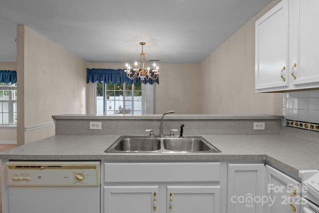 112 Dujon Ct, Mount Holly, NC 28120 - kitchen featuring dishwasher, a sink, a chandelier, white cabinetry, and plenty of natural light