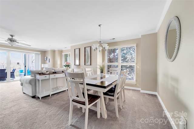 18631 Harborside Dr, Cornelius, NC 28031 - dining space featuring carpet floors, crown molding, a chandelier, baseboards, and ceiling fan
