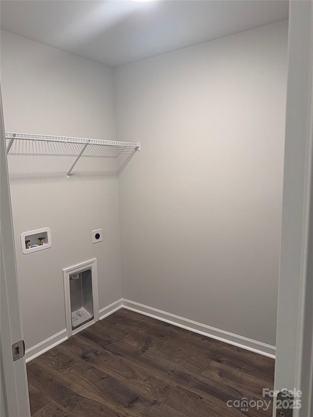 laundry area with hookup for a washing machine, dark wood finished floors, hookup for an electric dryer, and baseboards