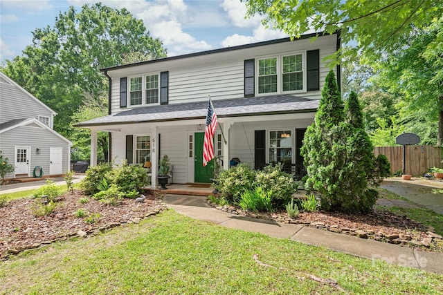 traditional-style house with covered porch