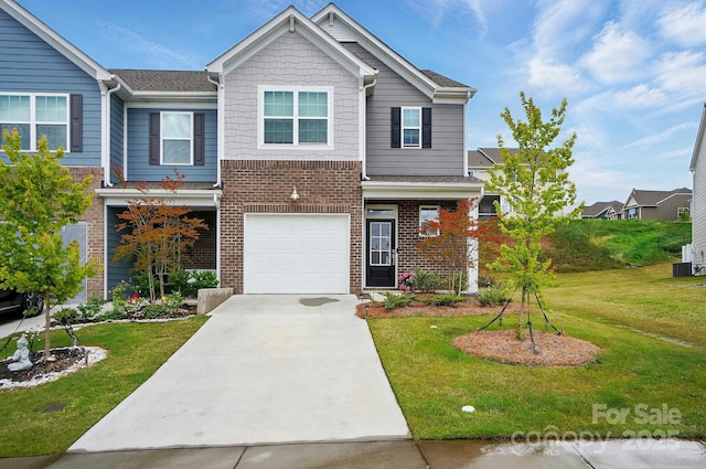 6037 Chelsea Oaks Rdg Unit 77, Tega Cay, SC 29708 - view of front of home featuring concrete driveway, brick siding, a front yard, a garage, and a shingled roof