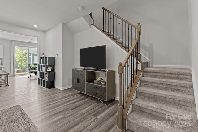5625 Axil Ln, Charlotte, NC 28269 - staircase with wood finished floors, baseboards, and recessed lighting