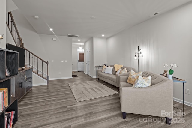 5625 Axil Ln, Charlotte, NC 28269 - living area featuring stairs, wood finished floors, baseboards, and recessed lighting