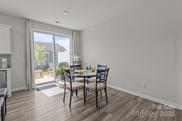 5625 Axil Ln, Charlotte, NC 28269 - dining space featuring wood finished floors and baseboards