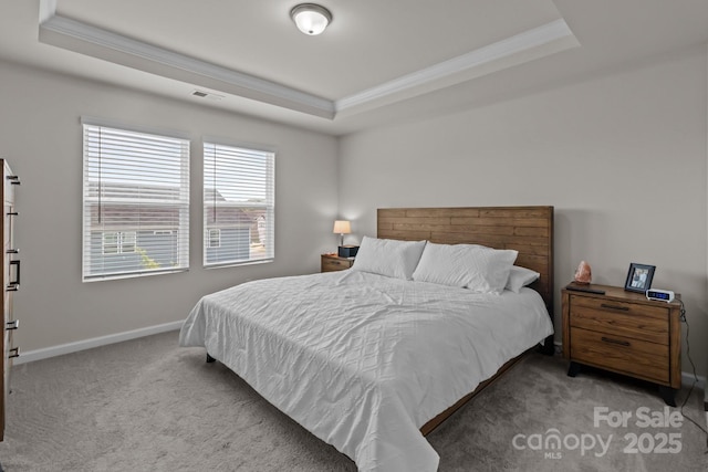5625 Axil Ln, Charlotte, NC 28269 - carpeted bedroom featuring a tray ceiling, crown molding, and baseboards