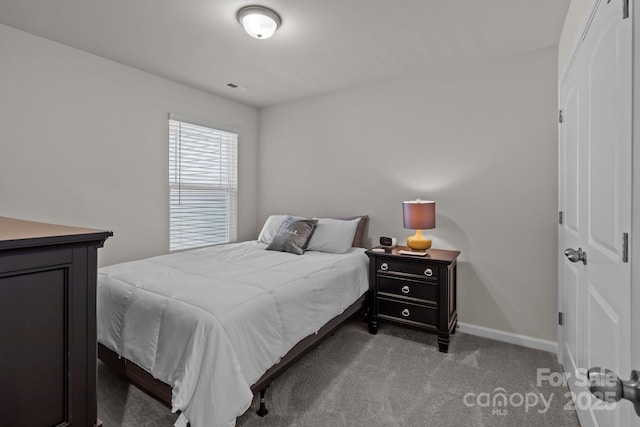 5625 Axil Ln, Charlotte, NC 28269 - bedroom featuring carpet flooring, baseboards, and a closet