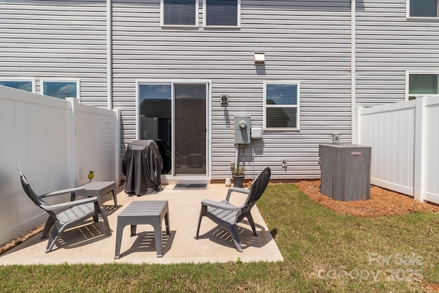 5625 Axil Ln, Charlotte, NC 28269 - back of property with central air condition unit and a patio