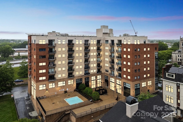 715 N Church St Unit 613, Charlotte, NC 28202 - property at dusk featuring a view of apartment building / complex