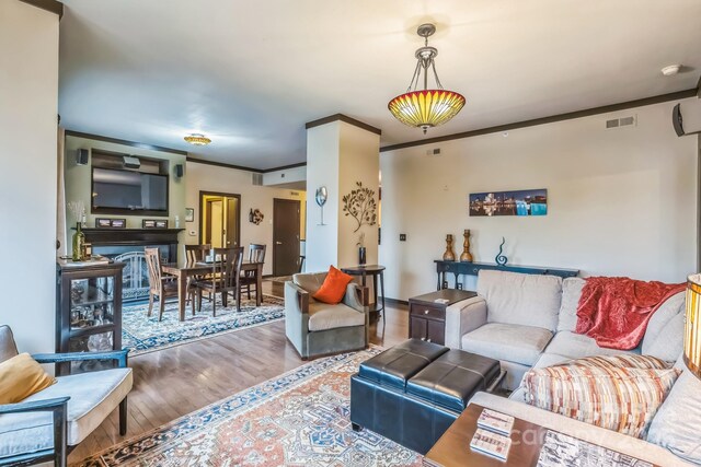 715 N Church St Unit 613, Charlotte, NC 28202 - living area featuring wood finished floors and ornamental molding