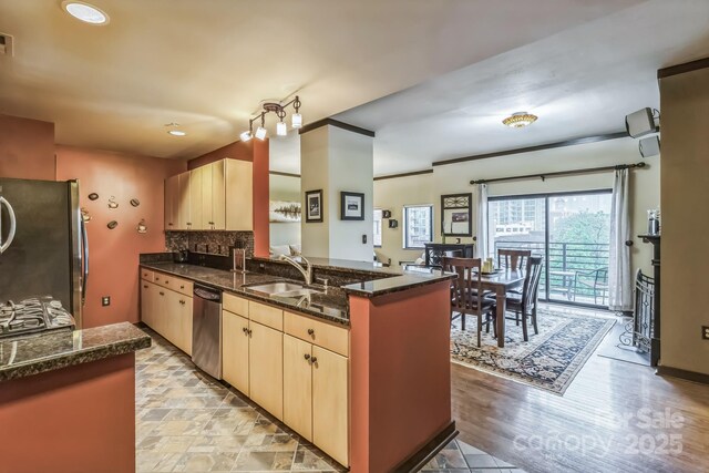715 N Church St Unit 613, Charlotte, NC 28202 - kitchen with stainless steel appliances, light brown cabinetry, a peninsula, a sink, and recessed lighting