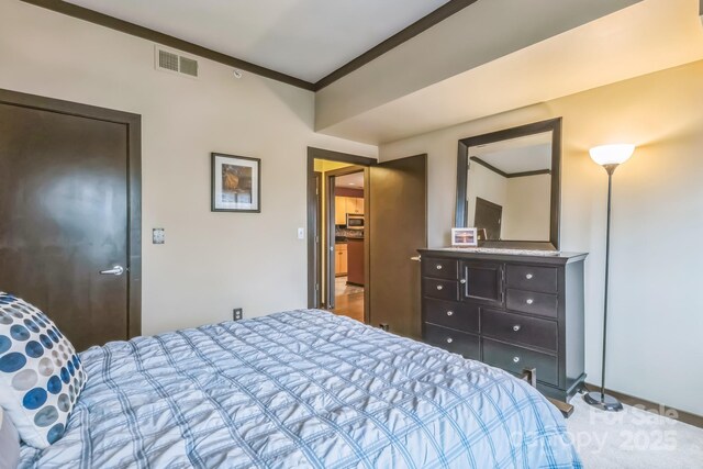 715 N Church St Unit 613, Charlotte, NC 28202 - carpeted bedroom with crown molding