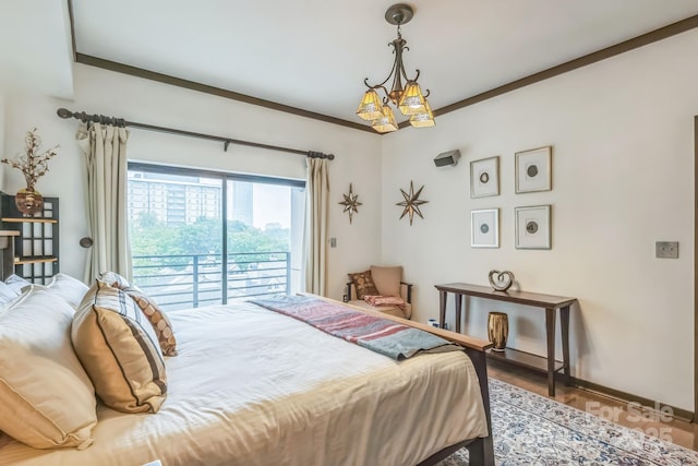 715 N Church St Unit 613, Charlotte, NC 28202 - bedroom with access to exterior, baseboards, and a chandelier