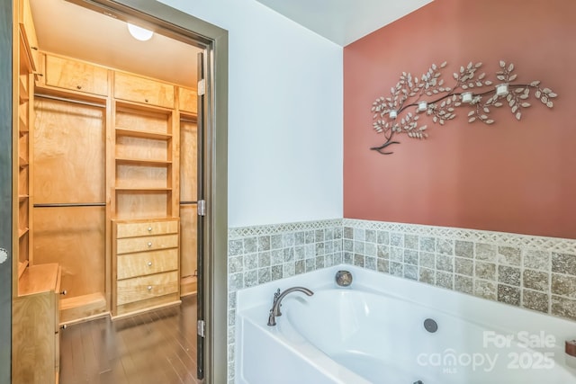 715 N Church St Unit 613, Charlotte, NC 28202 - bathroom with a garden tub and wood finished floors