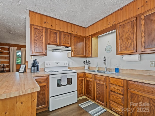 kitchen featuring white electric range oven, a sink, under cabinet range hood, a textured ceiling, and brown cabinets
