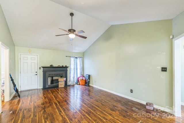 113 Stacy Ln, Raeford Township, NC 28376 - unfurnished living room with ceiling fan, lofted ceiling, a fireplace, wood finished floors, and baseboards