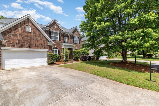 11526 Mcginns Trace Ct, Charlotte, NC 28277 - georgian-style home featuring brick siding, driveway, and a front yard