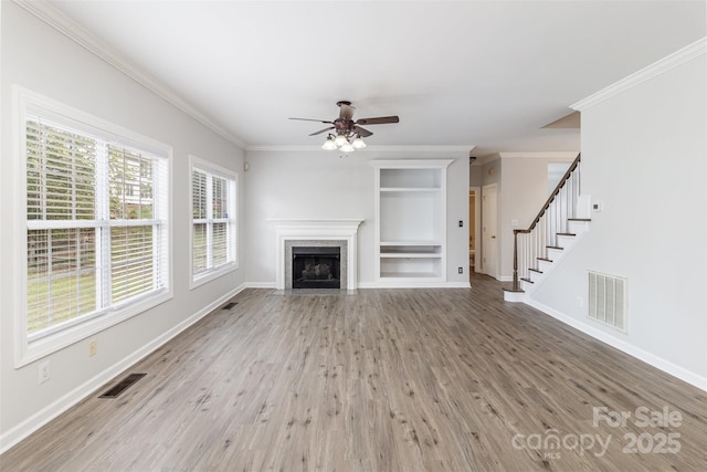 11526 Mcginns Trace Ct, Charlotte, NC 28277 - unfurnished living room with wood finished floors, built in shelves, a ceiling fan, baseboards, and ornamental molding