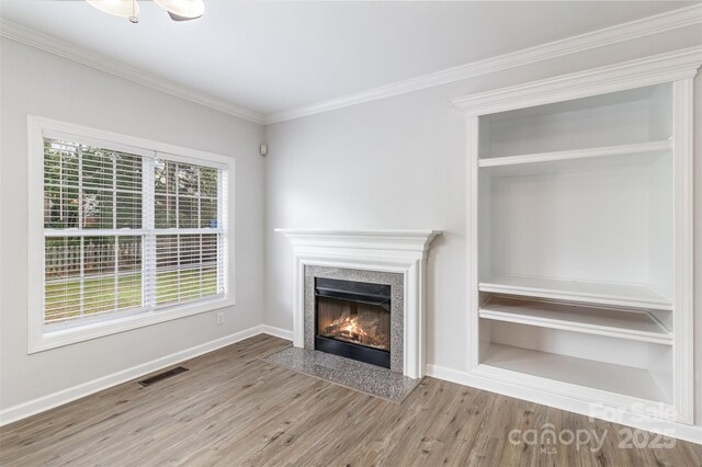 11526 Mcginns Trace Ct, Charlotte, NC 28277 - unfurnished living room featuring wood finished floors, crown molding, a high end fireplace, and baseboards