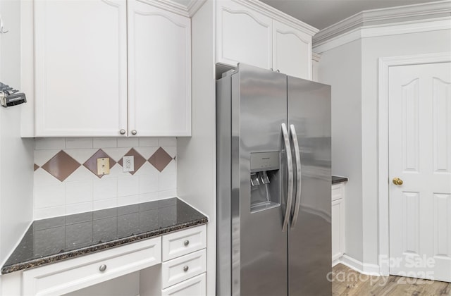 11526 Mcginns Trace Ct, Charlotte, NC 28277 - kitchen featuring stainless steel refrigerator with ice dispenser, dark stone counters, decorative backsplash, white cabinets, and crown molding