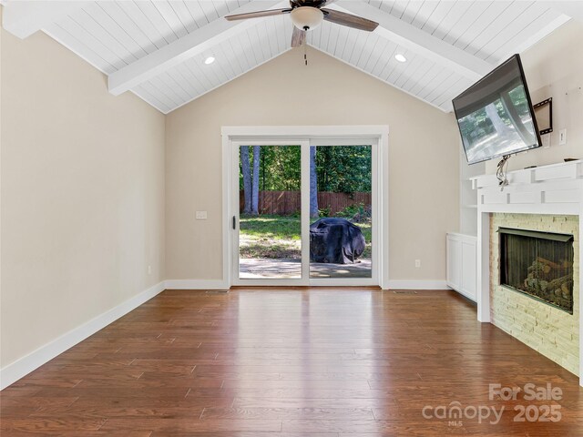 unfurnished living room featuring wood-type flooring, ceiling fan, a fireplace, baseboards, and wood ceiling